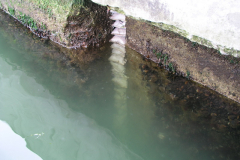 Filling excessive gaps with concrete.